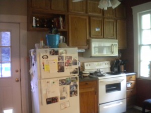 The stove side of the cabinets after.